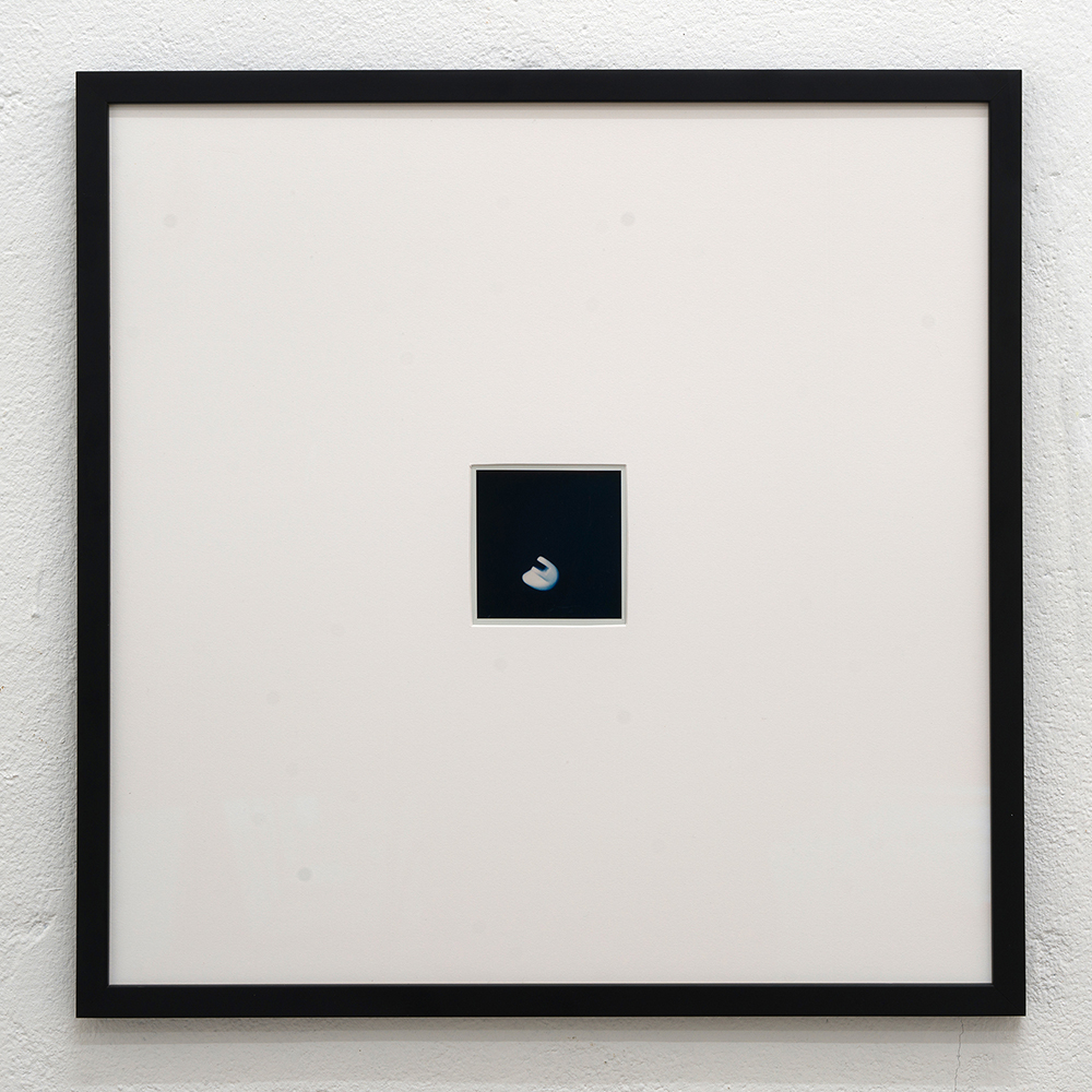 <em>Handle #2,</em> Polaroid sx-70, 40x40 cm, (framed) 8,1x8,4 cm (unframed), 2024.
